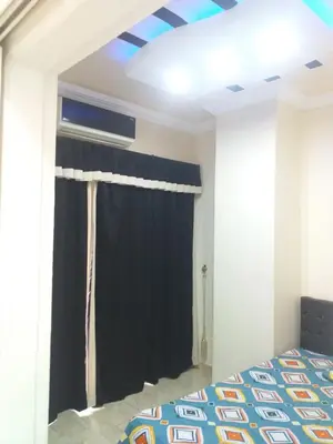 a bedroom with a bed and a window at sheraton 212 in Hurghada