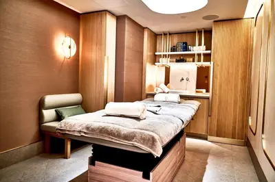 a room with a bed and a chair in it at Aqua Palms Resort by Ivan C408 in Hurghada