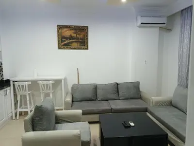 a living room with a couch and a table at sheraton blaza329 in Hurghada