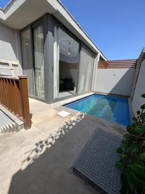a swimming pool in the side of a house at 2BR Twin House With Private Heated Pool at El-Gouna -Seperate 1Bedroom & Seperate Guest studio- in Hurghada