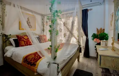 a bedroom with a bed with a canopy at Luxury 95m Penthouse - Boutique Resort & Wifi in Hurghada