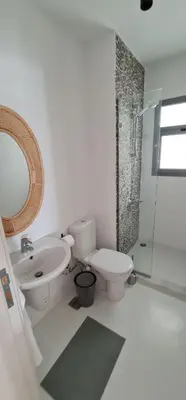 a bathroom with a toilet and a sink and a shower at EL Gouna Swan Lake Apartment in Hurghada
