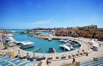 a marina in a city with boats in the water at EL Gouna Swan Lake Apartment in Hurghada