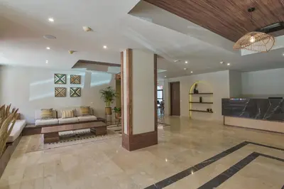 a living room with a couch and a fireplace at AJIRA Bay Hotel Hurghada Marina in Hurghada