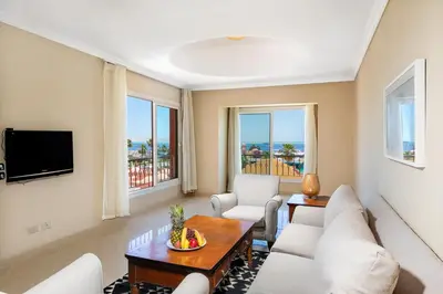 a living room with a couch and a table at AJIRA Bay Hotel Hurghada Marina in Hurghada