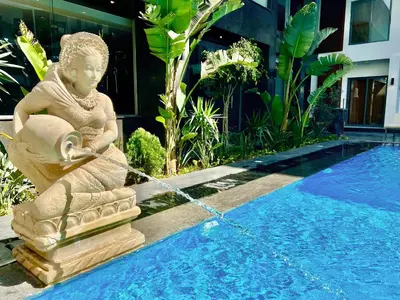 a statue chained to a swimming pool next to aitating at Imperial Resort Hurghada in Hurghada