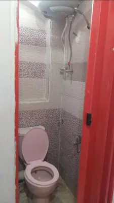 a bathroom with a toilet in a room at Aziza House in Aswan