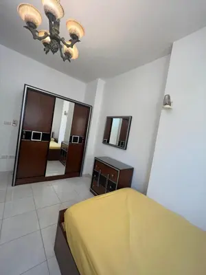 a bedroom with a bed and a large mirror at Paradise Hill Compound in Hurghada