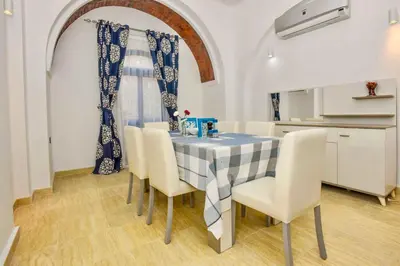 a kitchen and dining room with a table and chairs at Luxury 8BR Villa with seaview and private pool in Hurghada in Hurghada