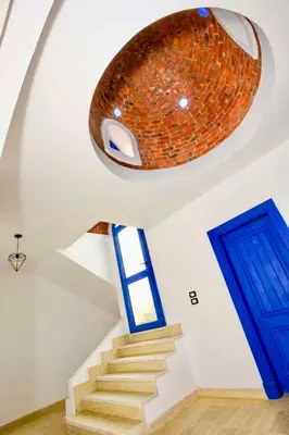 a room with a staircase with a large ceiling at Luxury 8BR Villa with seaview and private pool in Hurghada in Hurghada