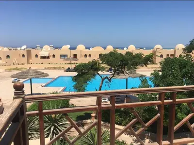 a view of the pool from the balcony of a resort at Pool view one bedroom - B203 in Hurghada