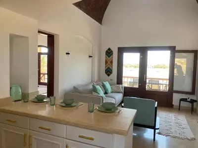 a living room with a couch and a table at Sabina 2br penthouse in Hurghada