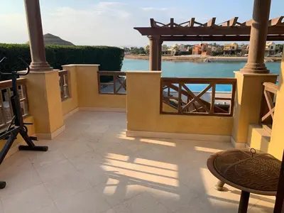 a patio with a view of the water at 3Bedrooms Villa with Private Pool and direct Lagoon Access in Hurghada