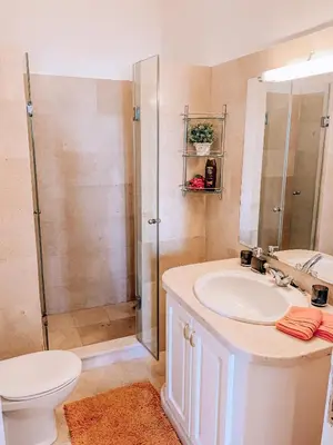 a bathroom with a sink and a shower at Snow White Villa in Hurghada
