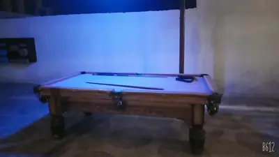 a pool table sitting in a room with at Dolphin Continental Hotel in Quseir