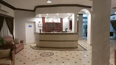 a lobby with a bar in the middle of a building at Dolphin Continental Hotel in Quseir