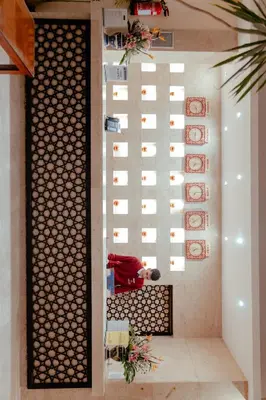 a staircase in a house with a wall with plates at Royal Star Beach Resort in Hurghada