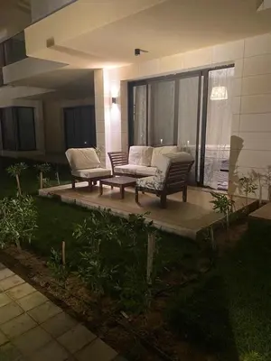 a patio with two chairs and a couch in front of a house at G-Cribs gouna in Hurghada