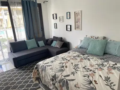 a living room with a bed and a couch at G-Cribs gouna in Hurghada