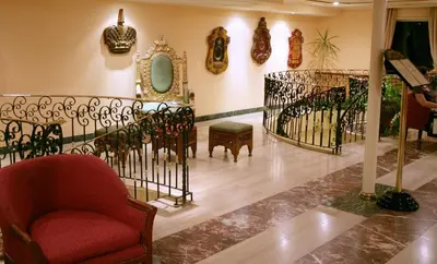 a room with a staircase with a chair and a mirror at Mövenpick Prince Abbas Lake Nasser Cruise, Every Monday Four Nights From Aswan, Every Friday Three nights From Abu-Simbel - Including Excursions and Sightseeing in Aswan