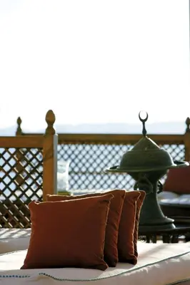 a pillow sitting on top of a table with a bell at Mövenpick Prince Abbas Lake Nasser Cruise, Every Monday Four Nights From Aswan, Every Friday Three nights From Abu-Simbel - Including Excursions and Sightseeing in Aswan
