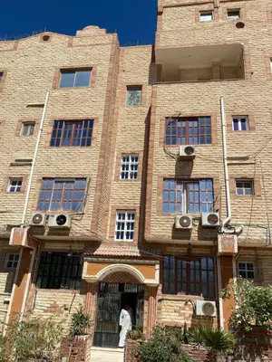 a person standing in the doorway of a brick building at PORTO HILL in Hurghada