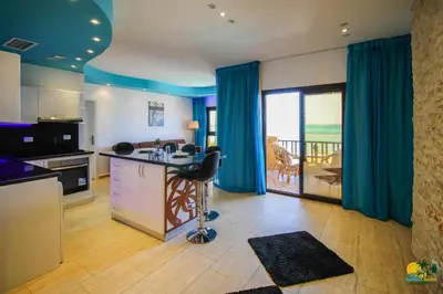 a kitchen with a island in the middle of a room at All View Apartements Hurghada in Hurghada