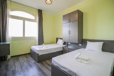 a hospital room with two beds and a window at Sahl Hasheesh, El Andalous by All View apartements in Hurghada