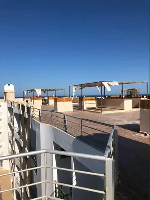 a roof of a building with a view of the ocean at Aqua Palms resort -Lovely studio in Hurghada