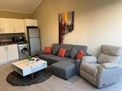 a living room with a couch and a table at Lovely 1BR with Private Heated pool at El-Gouna in Hurghada