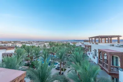 an aerial view of a resort with palm trees at Classy 1-Bedroom Apartment in Ancient Sands with Pool View in Hurghada