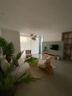 a living room with a couch and a tv at Stayr Somabay - Bay Life Home Rentals in Hurghada