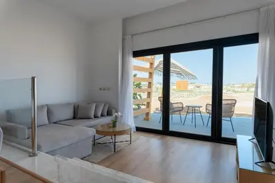 a living room with a couch and a tv at Stayr Somabay - Bay Life Home Rentals in Hurghada