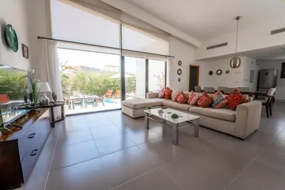a living room with a couch and a table at Stayr Somabay - Bay Life Home Rentals in Hurghada