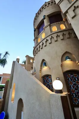a building with a clock tower on top of it at Villa Nur in Luxor