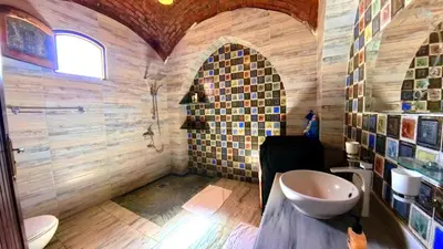 a bathroom with a toilet and a sink at Villa Nur in Luxor