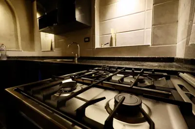 a stove top oven in a kitchen at Villa Nur in Luxor