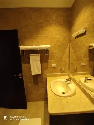 a bathroom with a sink and two sinks at Le Mirage bay resort and aqua park one bedroom private studio inside view aqua building in Hurghada