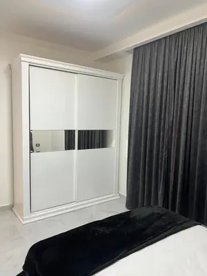 a bedroom with a large window and a bed at Boka Bay One in Hurghada