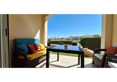a patio with a couch and a coffee table at El Gouna Waterside, 2-Bd Ground Floor Sleeps 4 Persons in El Gouna