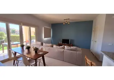 a living room with a couch and a table at El Gouna Waterside, 2-Bd Ground Floor Sleeps 4 Persons in El Gouna