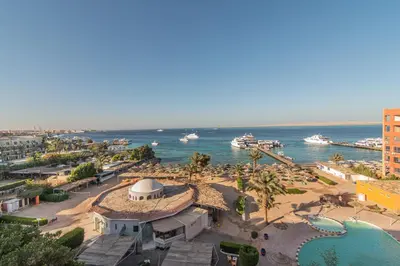 an aerial view of a beach and the ocean at Dexon Roma Hotel in Hurghada