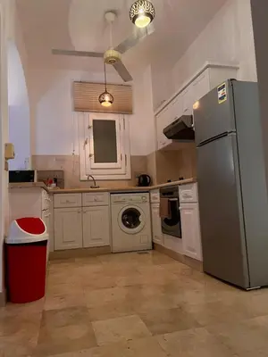 a kitchen with a refrigerator and a dishwasher at South Marina Apartment Wi-Fi available in Hurghada