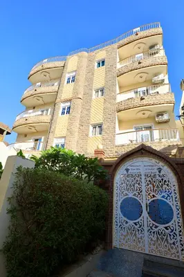 a tall building with a gate in front of it at Blue Nile House in Luxor