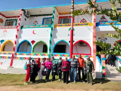 a group of people standing in front of a building at Nukud guest house in Aswan