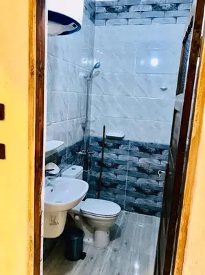 a bathroom with a toilet and a sink at Nukud guest house in Aswan