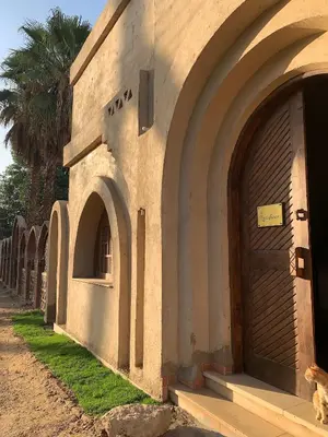 a building with arches on the side of it at The Residence in Luxor