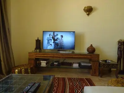 a living room with a flat screen tv on a table at Florenza - sea view in Hurghada