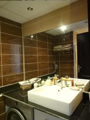 a bathroom with a white sink and a mirror at Florenza - sea view in Hurghada