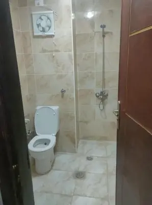 a bathroom with a toilet and a shower at Fully furnished Studio, At Tiba View, NUMBER R75 in Hurghada